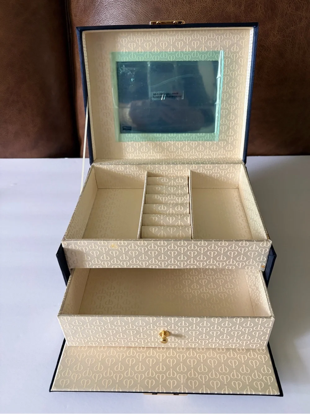NWOT Cle’ de Peau elegant blue satin small/travel jewelry box. Mirror. Drawer